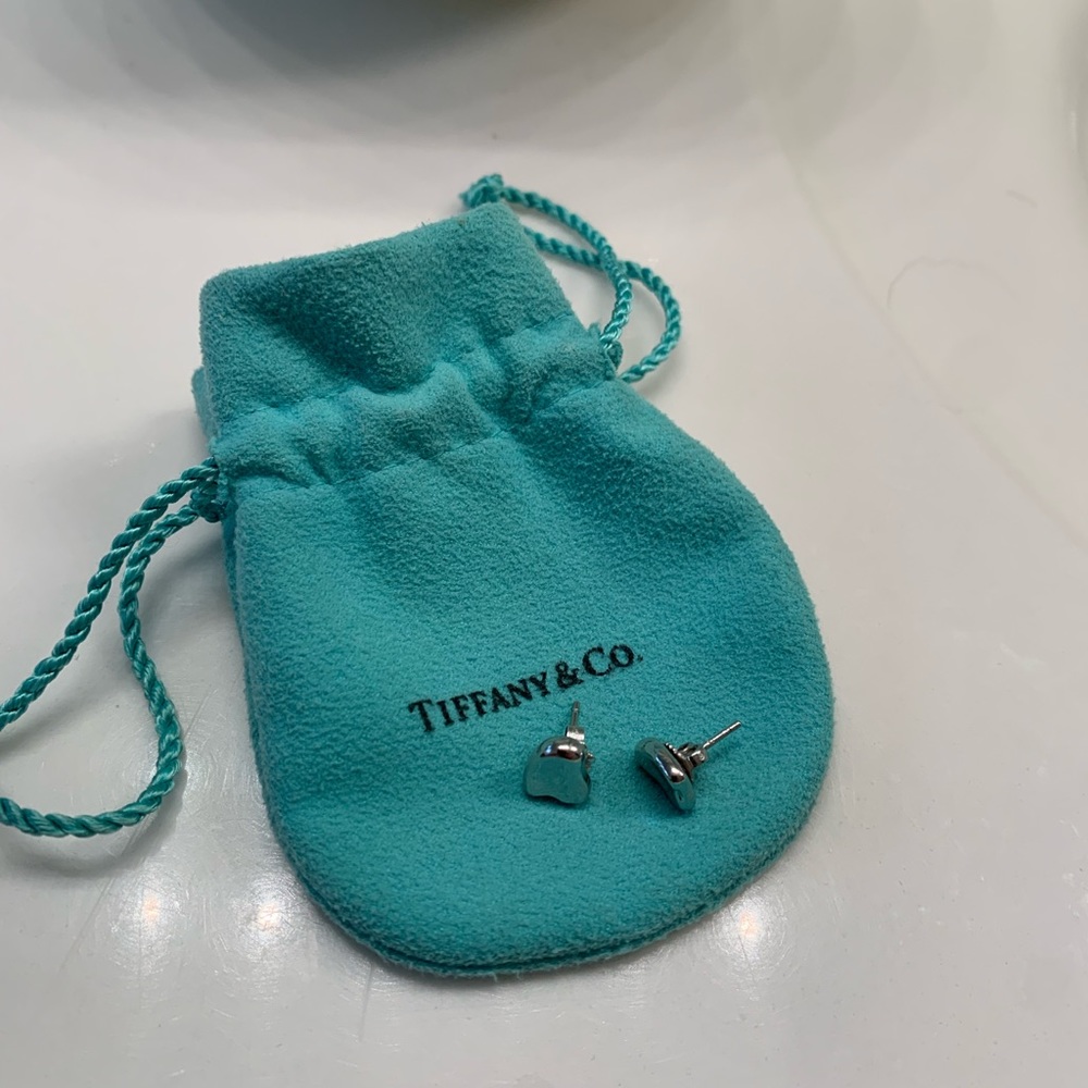Tiffany & Co. Elsa Peretti platinum heart stud earrings, pre-owned.